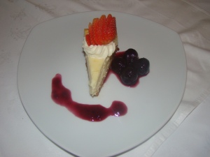Served with whipped cream, strawberry coulis and preserved blackberries